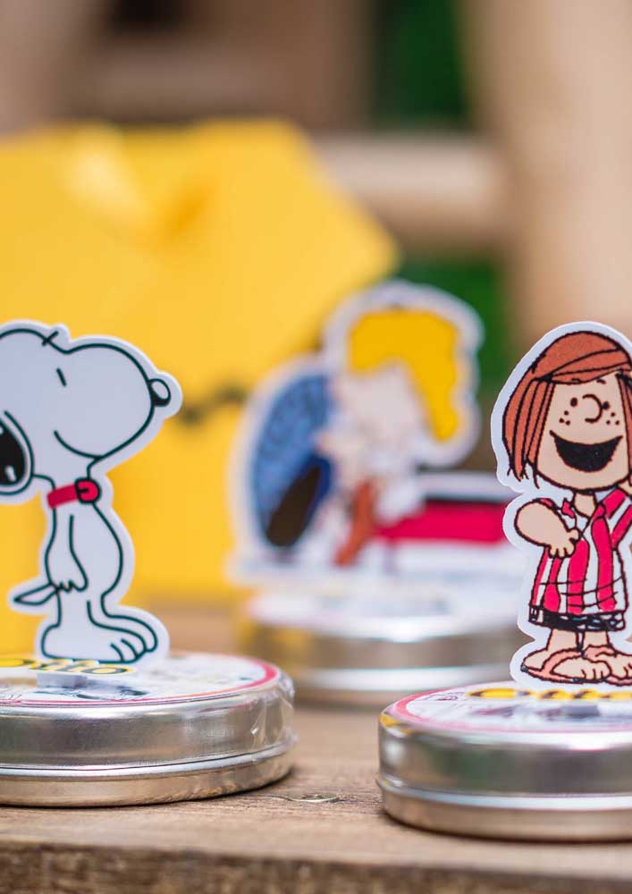 Totems of Snoopy and the other characters in the class decorate the candy cans at the party