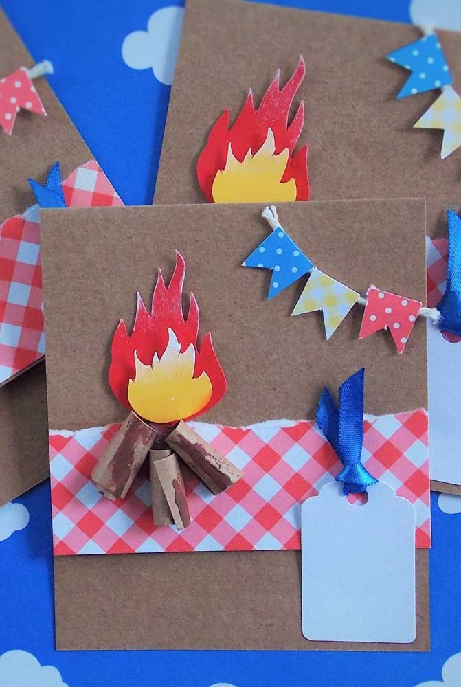 Handmade junina party invitation with campfire and flags