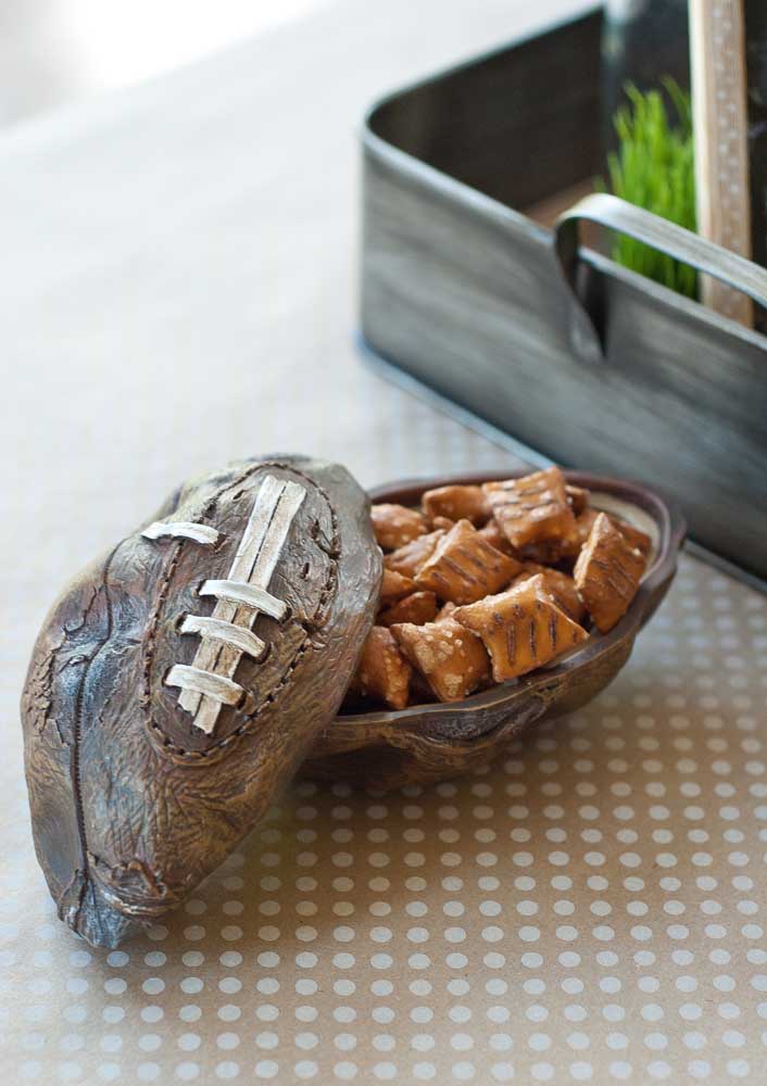 American football ball carved in wood. A beautiful decorative piece for sports lovers