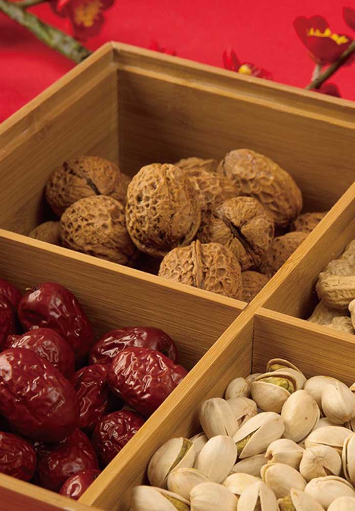 Nuts, pistachios, peanuts and olives as appetizers for the Chinese New Year party