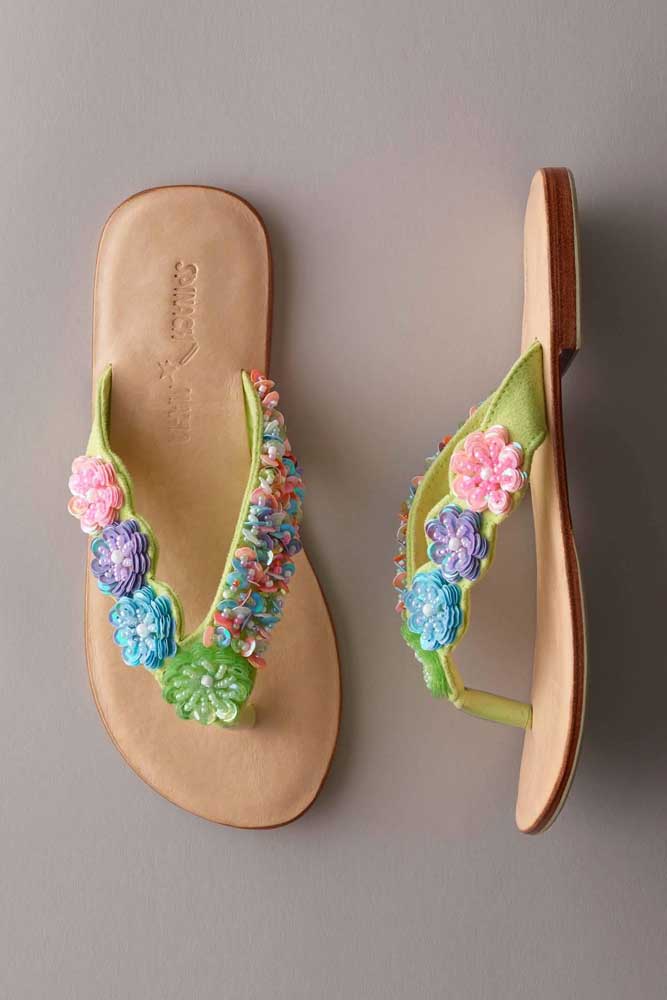 Beaded flowers decorate this leather slipper