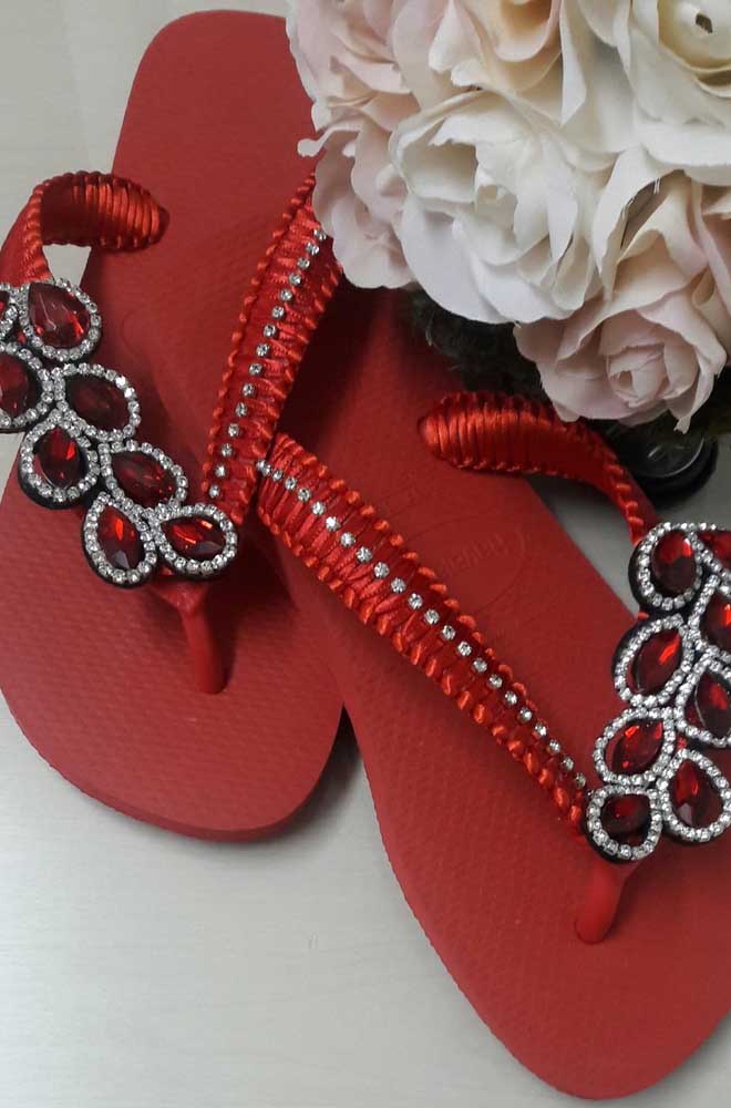 Red slipper embroidered with ribbon and stones