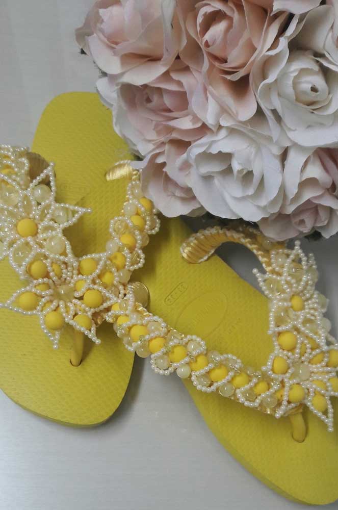 How about rocking the look with a yellow embroidered slipper?