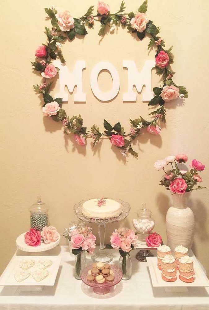 Look at the simplest and most beautiful idea: Mother's Day panel made with paper letters and garland of flowers. Everything glued directly to the wall