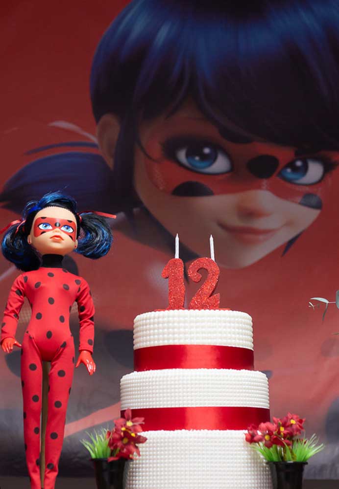 A three-tiered cake with a Ladybug theme to celebrate the 12th anniversary in style