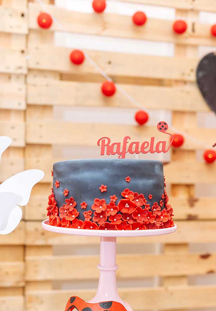 Simple Ladybug cake decorated with American paste in black and red colors