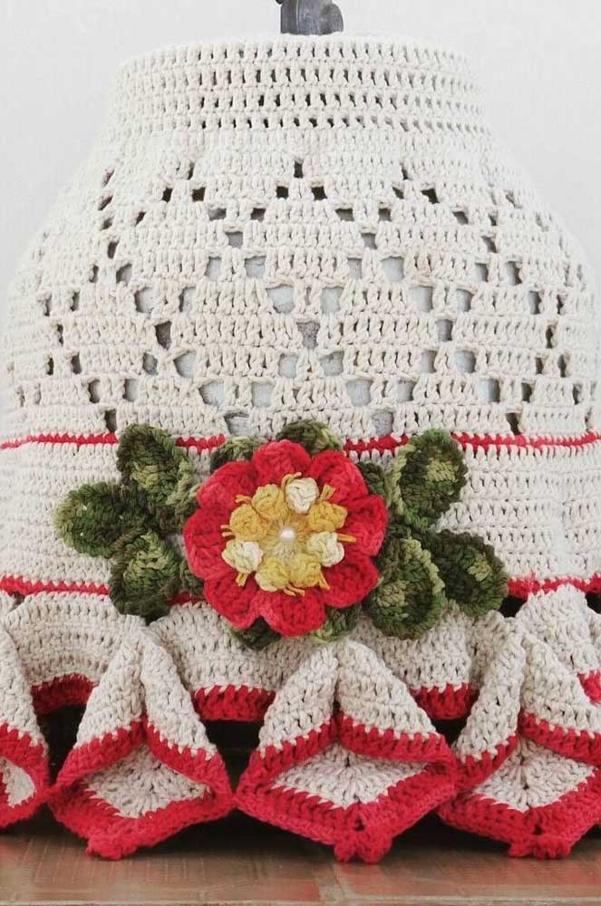 Crochet cover with crochet flower appliqué