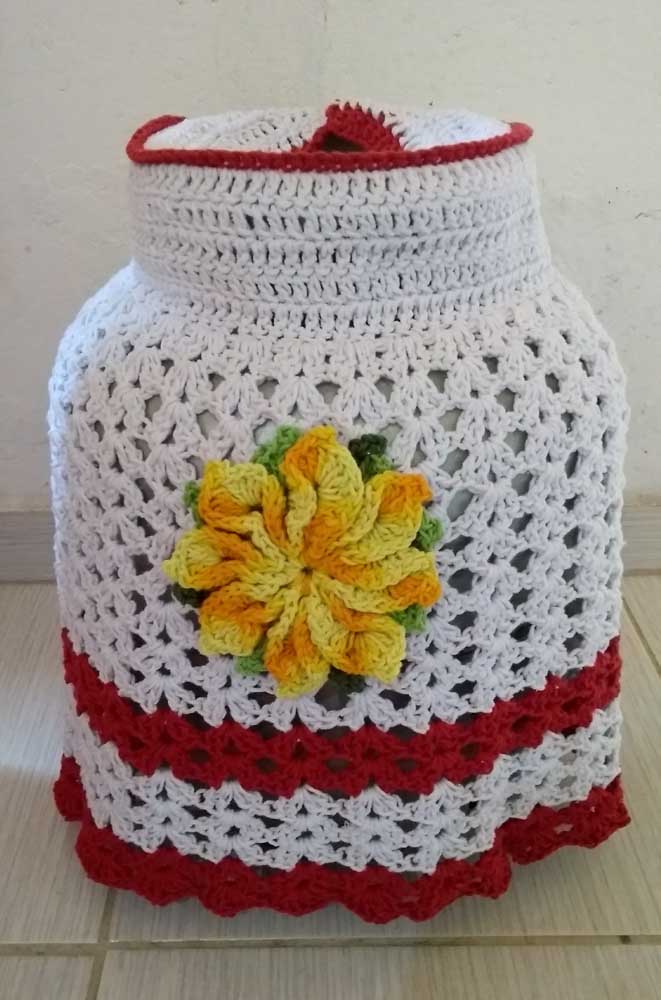 Crochet cover in white with red and yellow details