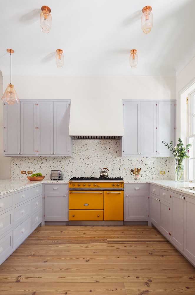 Large Provencal kitchen with gray cabinets and an extroverted yellow retro stove