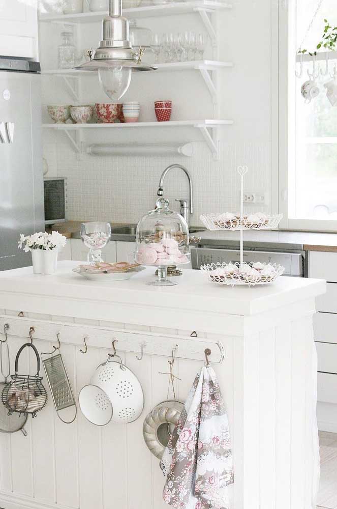 The exposed dishes are the highlight of this white Provencal kitchen