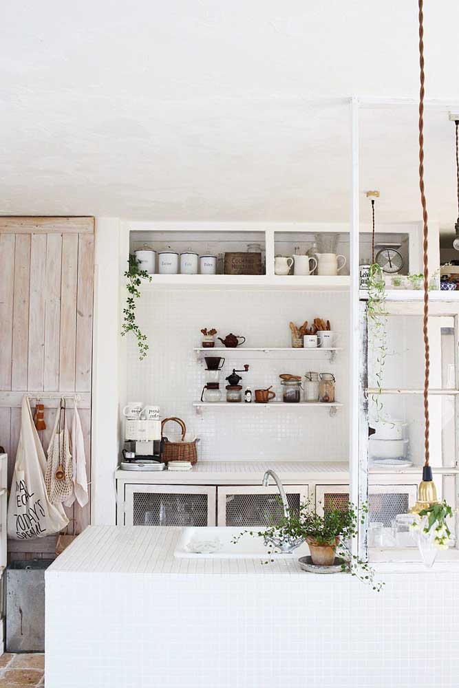 Impossible to glance through this Provencal kitchen without falling in love with the worn out door