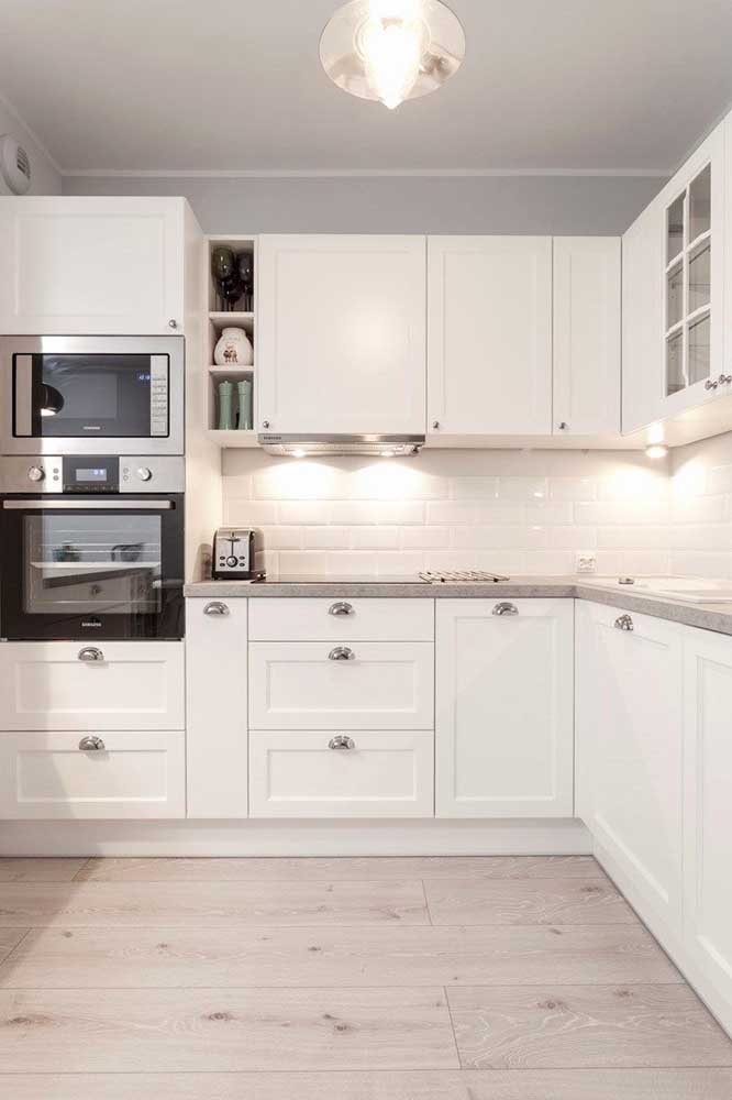 White Provencal kitchen with modern appliances