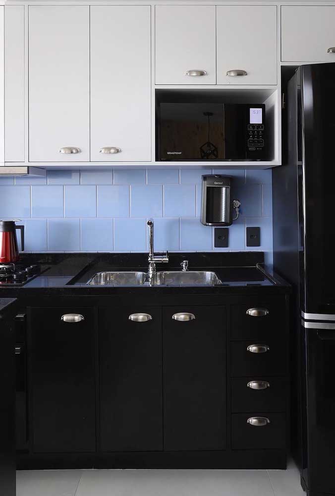 Small Provencal kitchen with a bold combination of black, white and blue