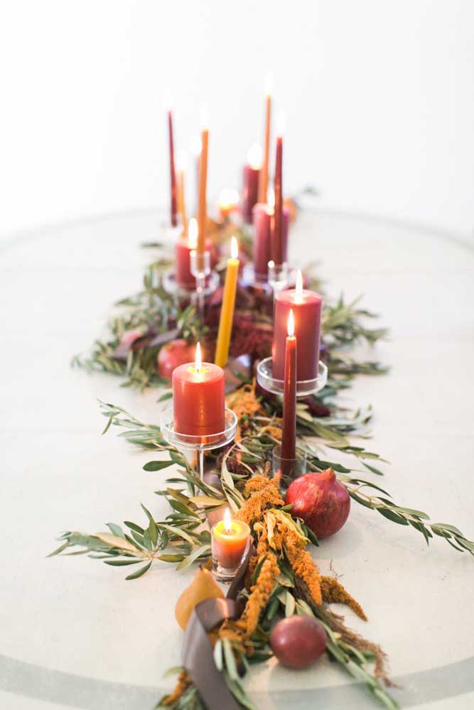 Christmas arrangement with candles to decorate the supper table. Notice that only red candles were used