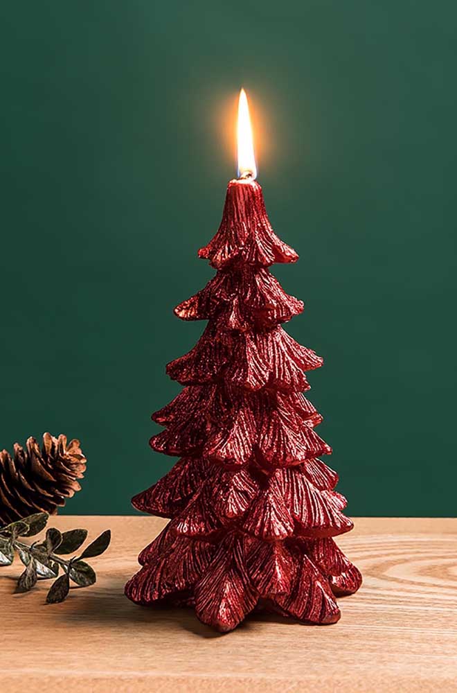 Red Christmas candle in pine shape. Two decorations in one