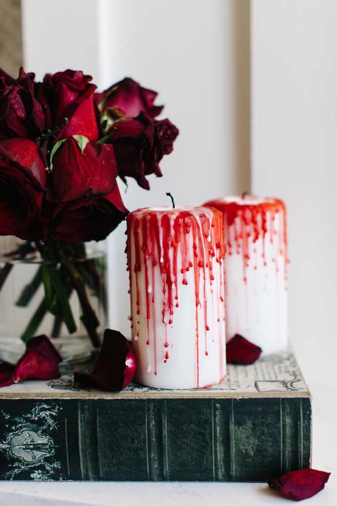 Candles with red tears. Beautiful inspiration for Christmas