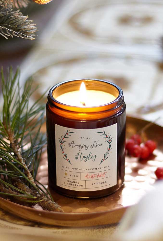 Candle, twigs and fruits to decorate the Christmas dinner