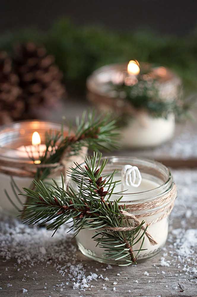 Pine branches advertise Christmas decoration on candles