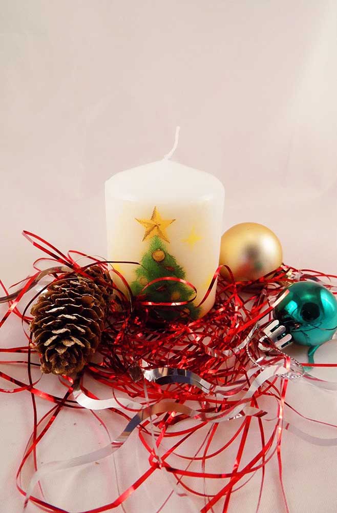 How about using your artistic gifts and painting a Christmas tree on the candle?