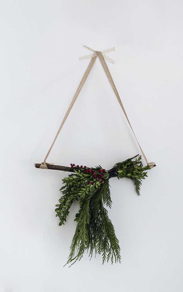 Branch, leaves and ribbon forming an unpretentious and rustic triangle