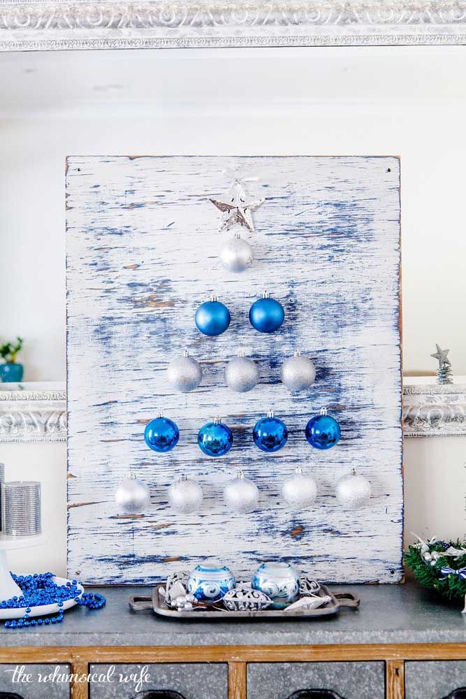 Christmas panel formed by blue polka dots and a background with patina effect