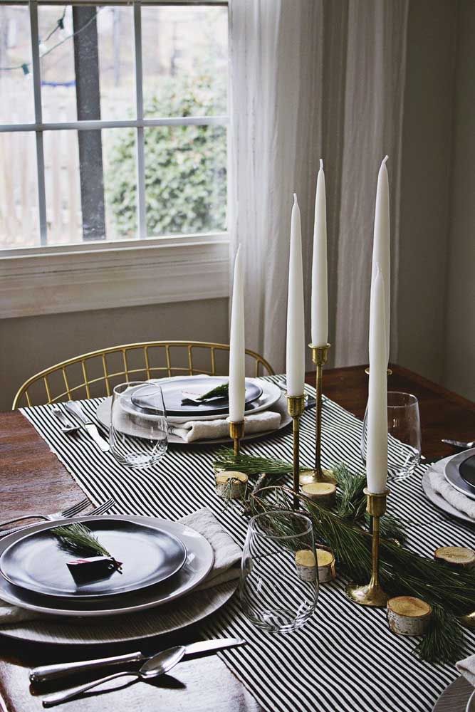 Tall candles for an elegant and sophisticated Christmas table ornament