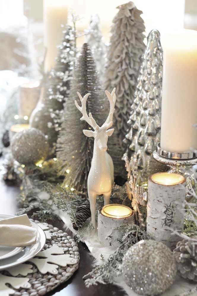 The reindeer found its natural habitat on this table richly decorated with pine trees