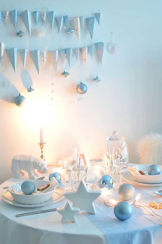 Star and polar bear share space with crockery and cutlery on this small Christmas table