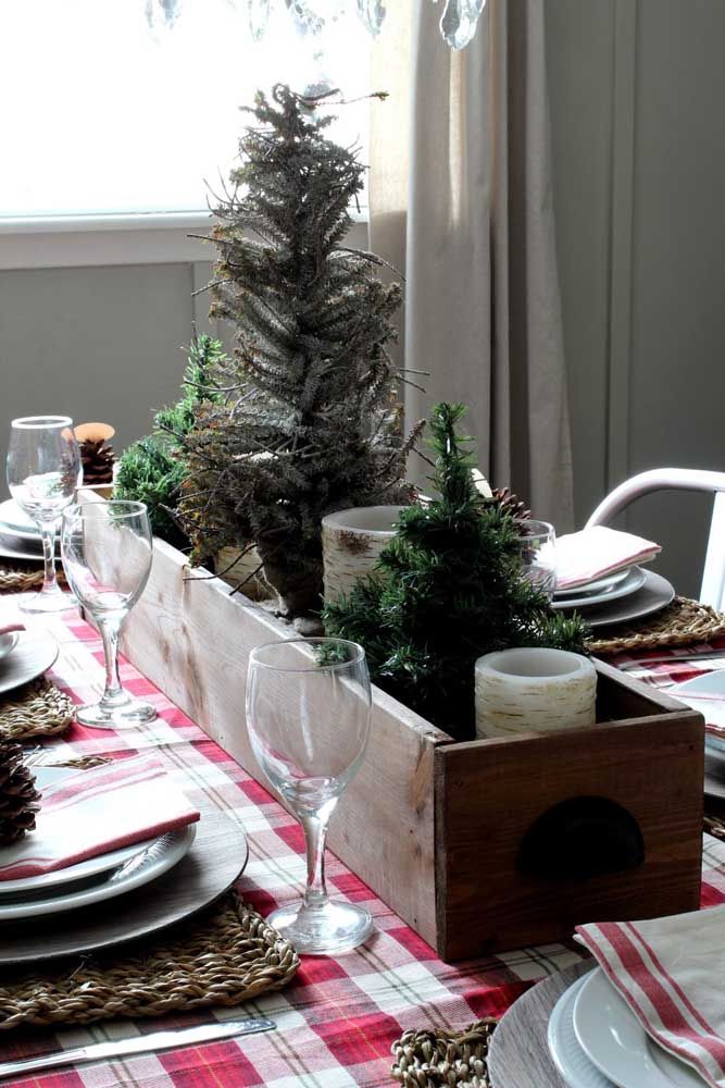 The red checkered cloth calls for a Christmas ornament with wood and shades of green