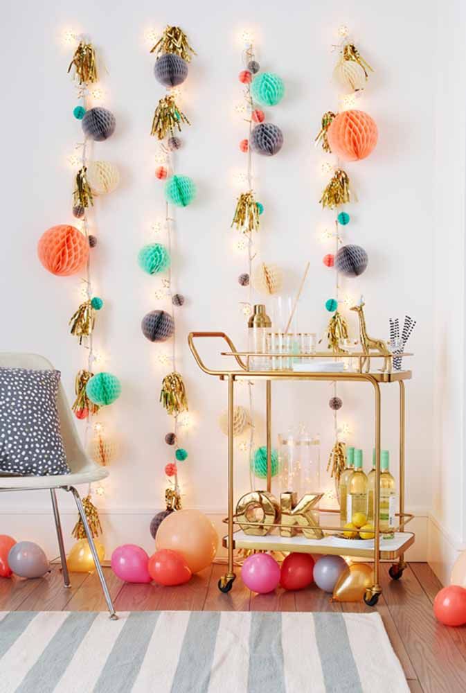 Instead of decorating the ceiling, make some colorful arrangements to hang on the wall