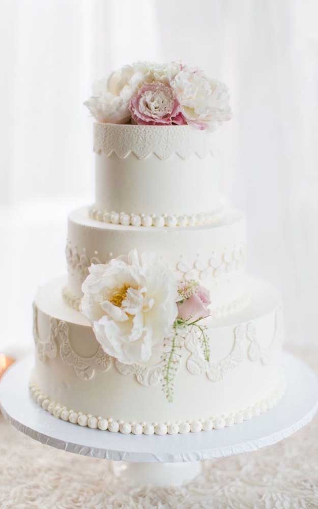 Fake wedding cake. White tones and delicate details are perfect for celebrations of this type