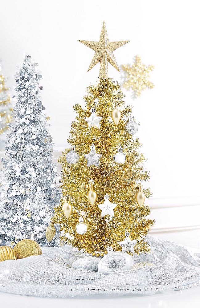 This Christmas decoration mixes mini Christmas trees in golden and silver tones