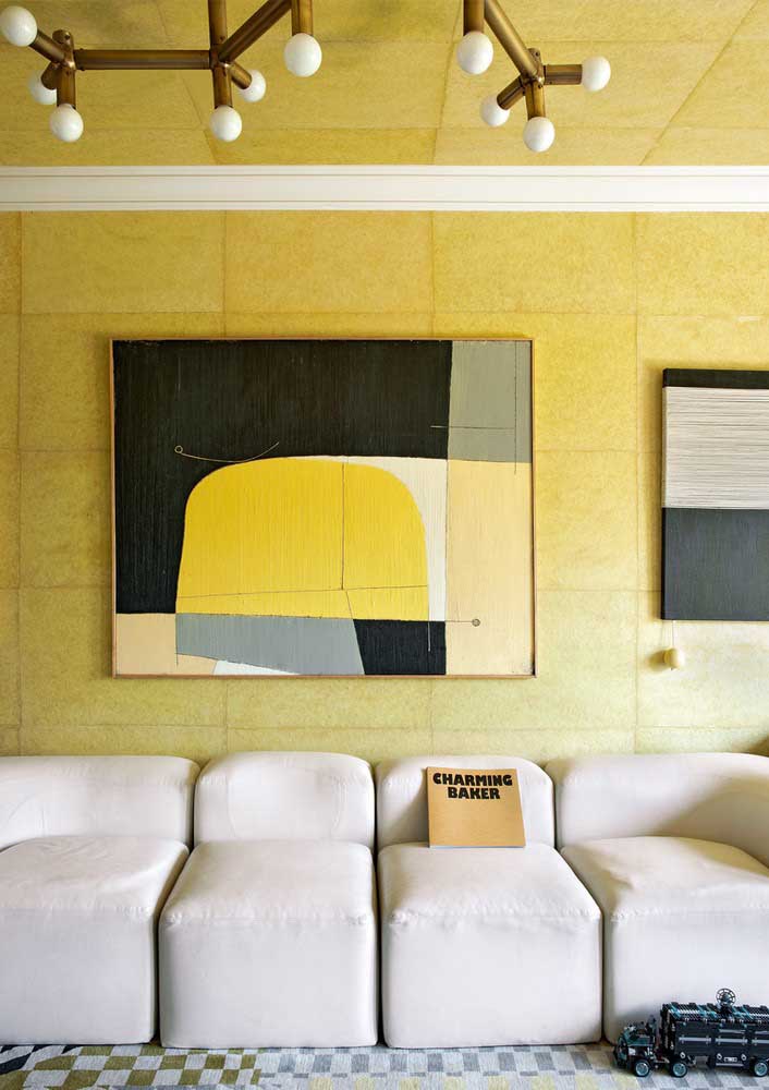 How about a yellow frame to reinforce the color that is also on the wall?