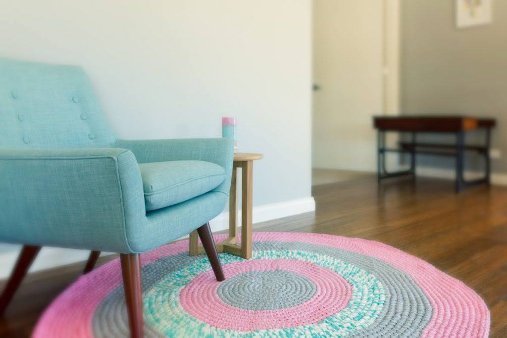 Round rug composing with the armchair