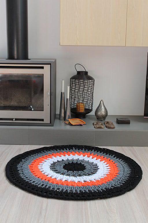 Crochet rug in shades of black, white and orange