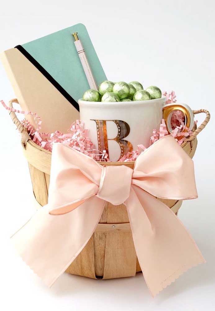 Easter basket with chocolate eggs in mug and notebook