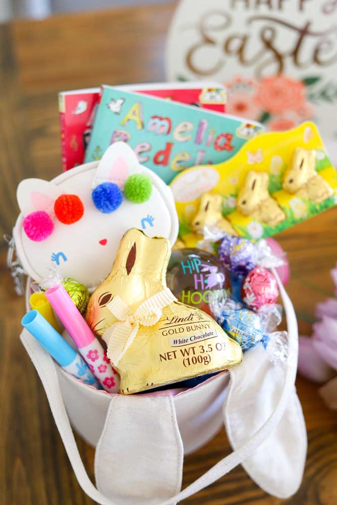 Small Easter basket made with crepe paper, inside rabbit and chocolate eggs