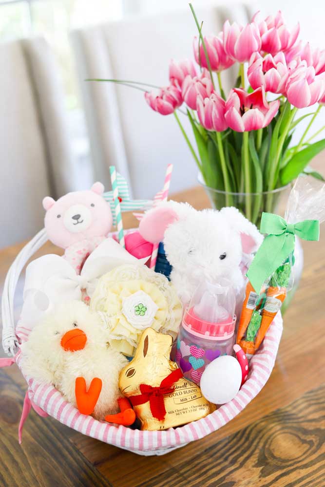 Easter basket with stuffed animals, carrots and chocolate bunny