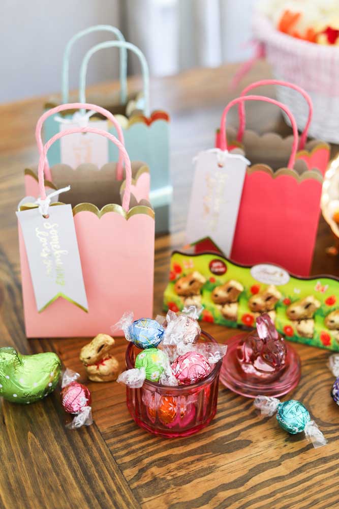 Easter baskets in paper bags with chocolates and chocolate bunnies