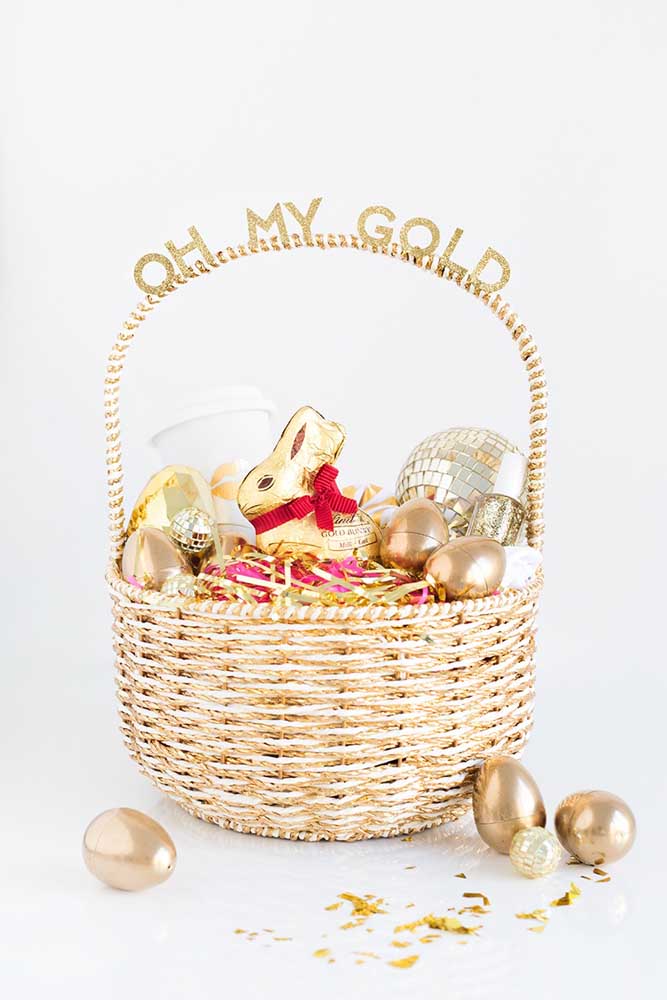 Golden Easter basket with chocolate eggs in the same color