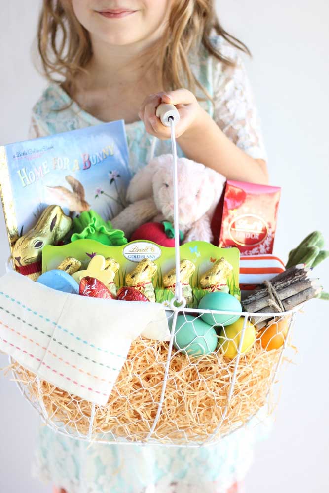 Large Easter basket for children with chocolates, books and toys