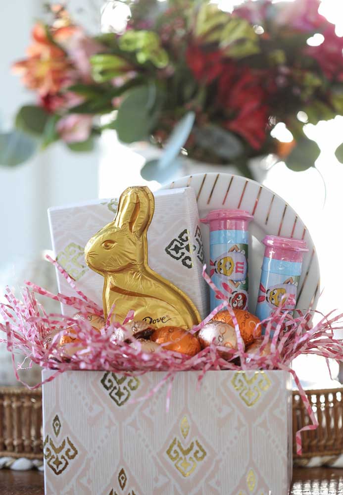 Simple Easter basket with chocolate bunny and colorful eggs