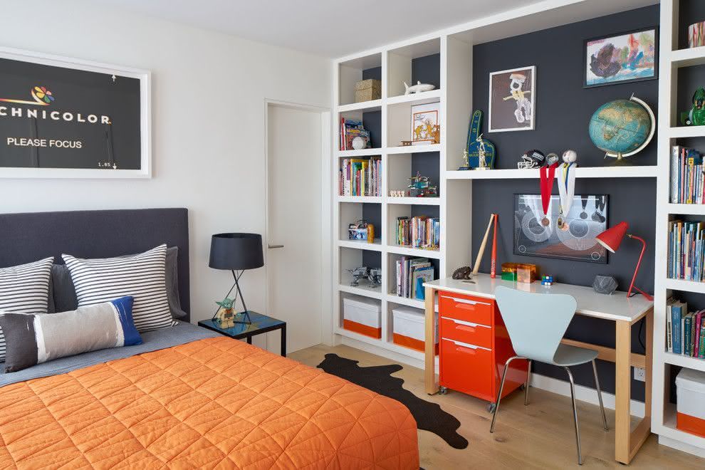 Room with large shelf for books and decorative objects.