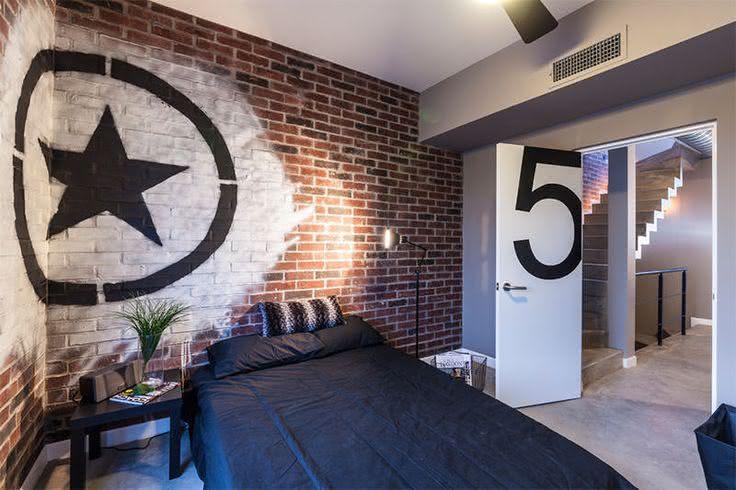 Teenager room with brick and graffiti wall