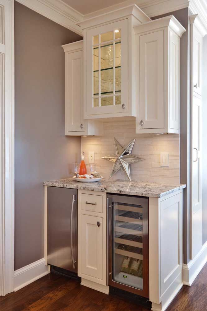 In this kitchen, the small counter was made with gray granite, to match, wall and furniture in the same tone