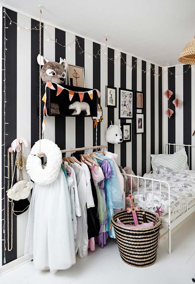Black and white striped wallpaper in girl's room decor