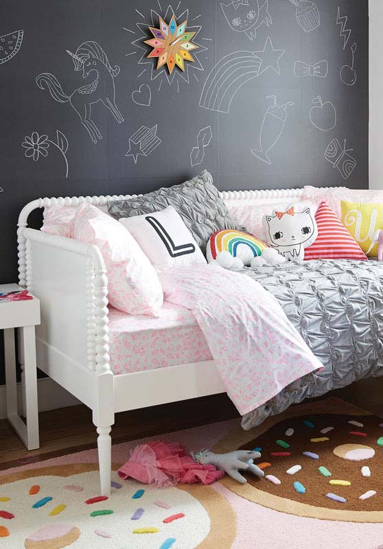 Chalkboard wall with illustrations in girl room decor
