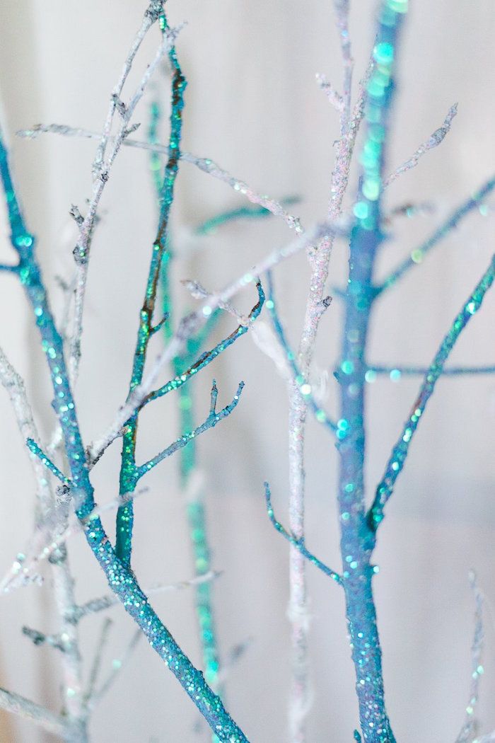 Cover dry branches with glitter and add a glam touch!