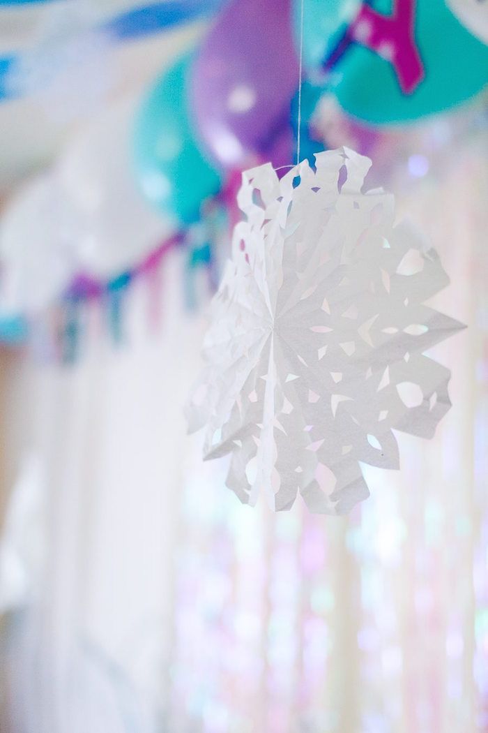 Decorate the room with paper snowflakes.