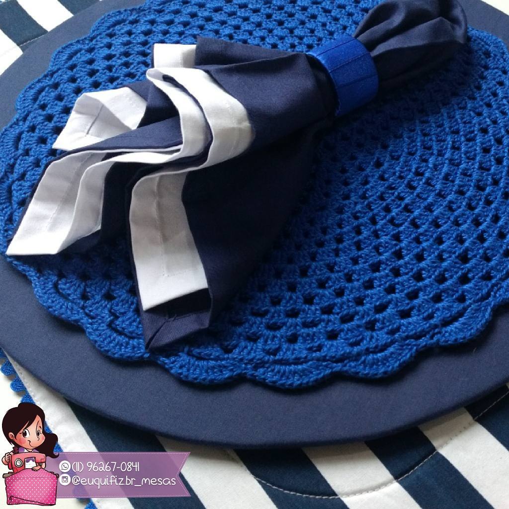 Blue crochet sousplat on base for the plate and napkin that matches the game.